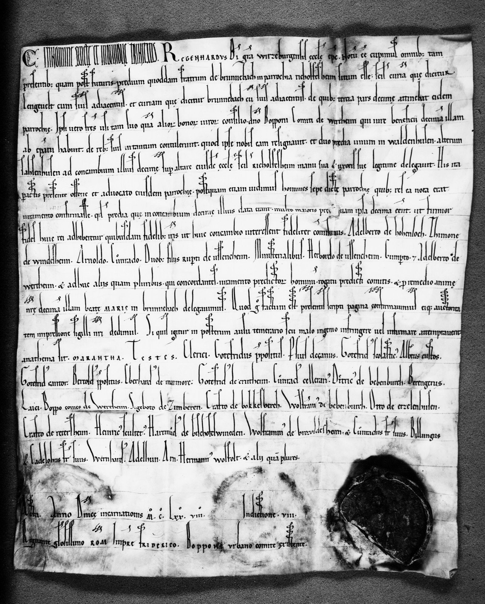 Die Urkunde von 1178: Bischof Reinhard (Regenhard) von Würzburg beurkundet den Tauschvertrag der Abtei Bronnbach mit der Pfarrei Reicholzheim — rechts unten das Wachssiegel.